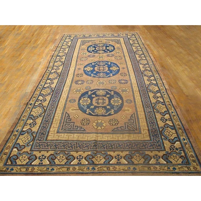 19th Century Central Asian Khotan Carpet with ocher background and patterned border. ( 6'3" x 13'5" - 190 x 410 )