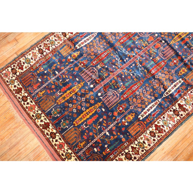 An early 21st Century Persian Rug with an all over willow tree design on an indigo field