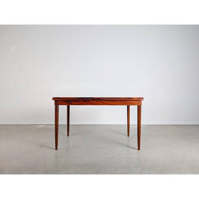 Beautiful extendable vintage dining table made of rosewood for sale. The design is by Niels Otto Møller, one of the most...