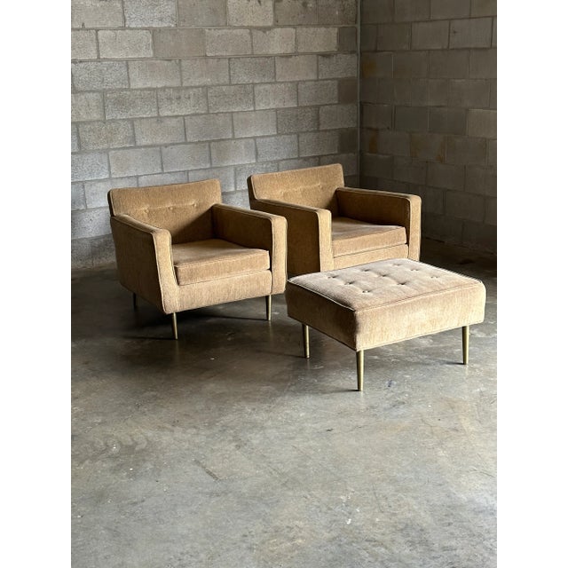 A wonderful pair of chairs with accompanying ottoman by Edward Wormley for Dunbar. Features a generous and comfortable...