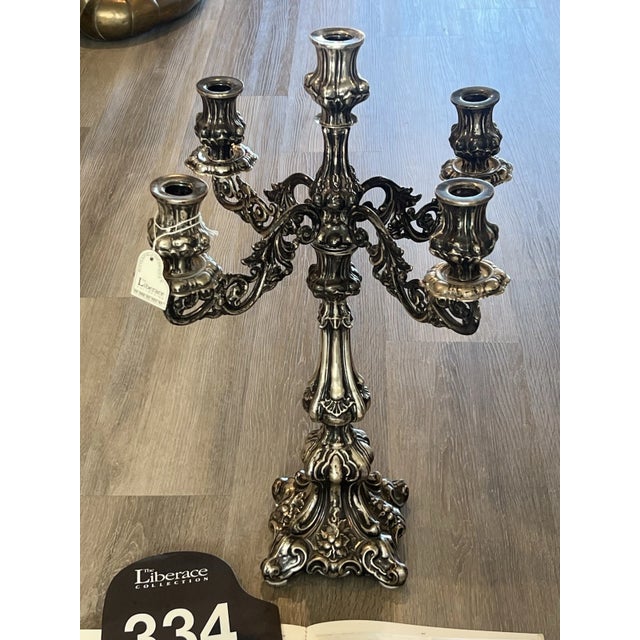 A museum-grade, historic sterling silver multi-light candelabra originating directly from the famous personal collection...