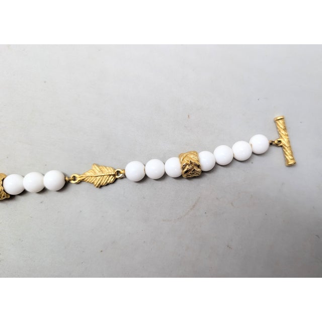 Givenchy Vintage 1980s Signed Givenchy Goldtone & White Resin Leaf Toggle Bracelet For Sale - Image 4 of 8
