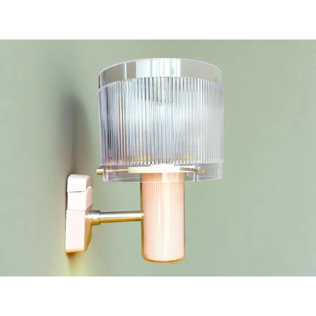 New vintage wall sconce. Made in portugal by vivaldi. it is made of plastic and acrylic material. The plastic base is in...