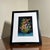 Beautiful vintage floral still life painting featuring a vibrant bouquet of multicolored flowers arranged in a decorative...