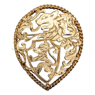 Vintage 1970s Signed Napier Goldtone Cut Out Rearing Lion Coat of Arms Brooch For Sale