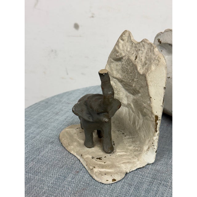 Design Plus Gallery presents a Pair of Vintage Painted Elephant Bookends. This vintage pair is made of cast metal and...