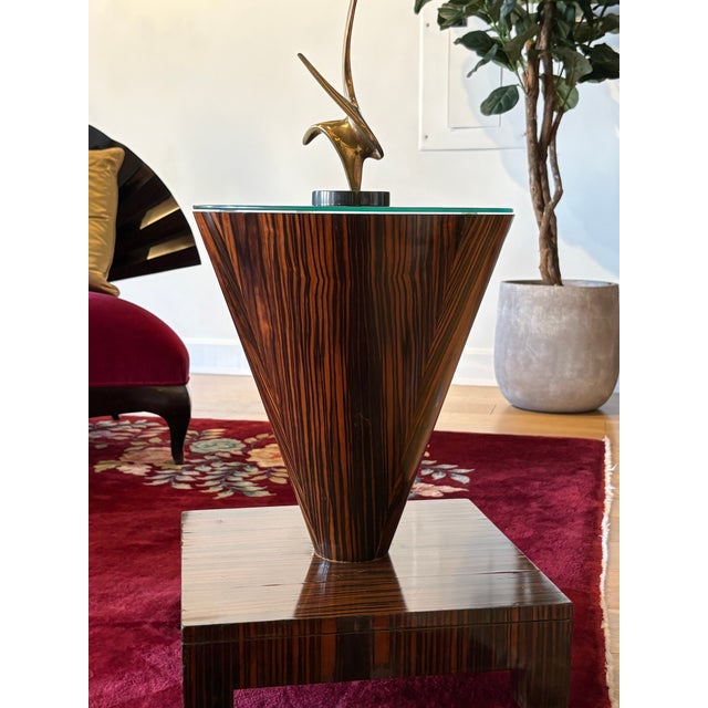 A set of beautiful Vintage art deco solid macassar wood side tables in a unique shape. Glass protector tops. Great...