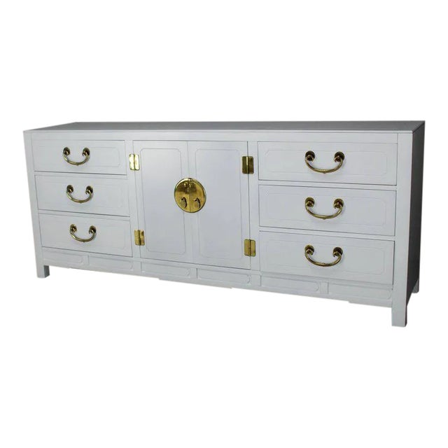 Stunning white lacquer cabinet with polished brass pulls. Medium gloss finish.