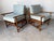 A beautiful pair of vintage rattan bamboo lounge chairs featuring sturdy bamboo frames with wrapped rattan and cushions. A...