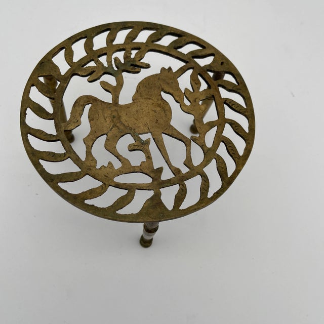 Lovely 19th Century English Pierced brass trivet stand with horse decoration on three turned legs. Equestrian.