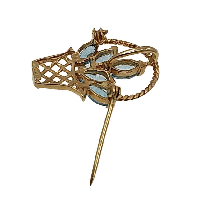 Estate 14K gold blue topaz flower basket pin or pendant. This 14 karat yellow gold flower basket features five marquise...