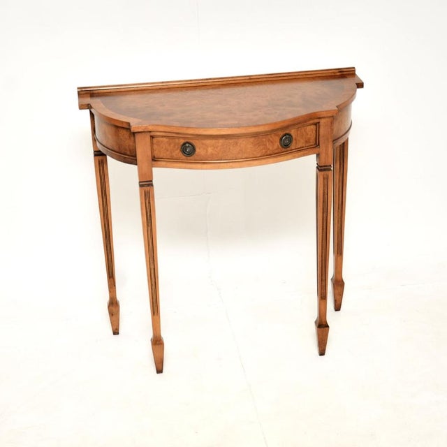 A beautiful and elegant antique Georgian style burr walnut console table. This was made in England, it dates from around...