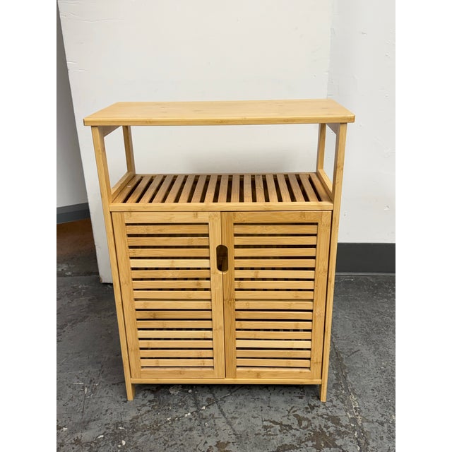 Design Plus Gallery presents a Bamboo Double Door Storage Cabinet. This contemporary cabinet showcases a natural bamboo...