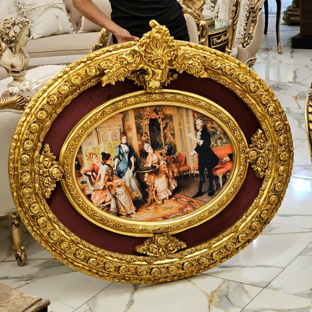 Bring the elegance of a grand European salon into your home with this distinctive oval artwork, featuring a richly...