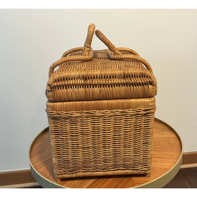 Charming vintage woven wicker picnic basket featuring a warm honey-toned patina and classic craftsmanship. This basket has...