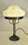 Wrought iron and glass table lamp made in Sweden in the 1920s. The lamp is very simple in the design but yet very...