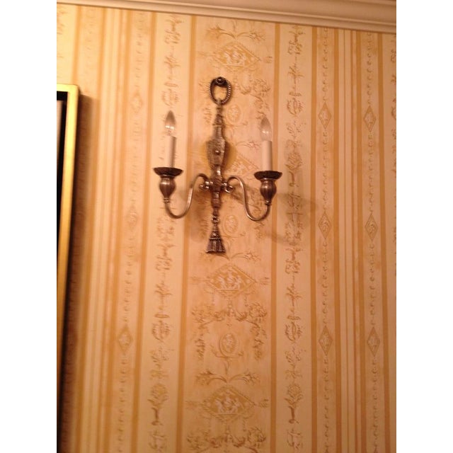 Circa 1900 A pair of silverplated bronze, double-branch wall sconces with finely chased low relief details throughout. By...