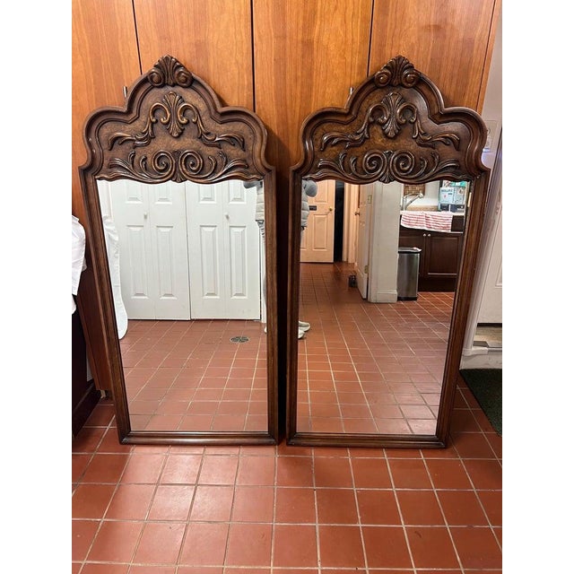 Pair of Elaborately Carved Wooden Mirrors. Perfect for his and hers bathroom vanities or dressers. Warm wooden tones and a...