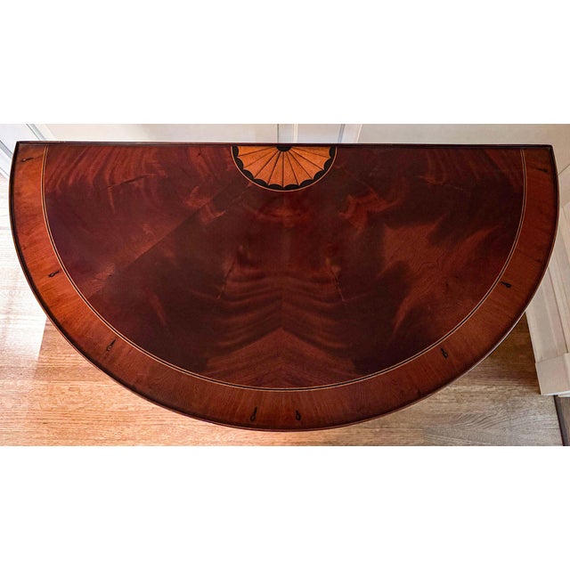 Beautifully inlaid federal style demi-lune table. Perfect for small areas.