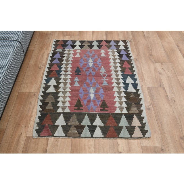 Vintage Turkish Hand-Knotted vintage rug is a semi-antique vintage area rug. The '70s Eastern region of Turkey's unique...