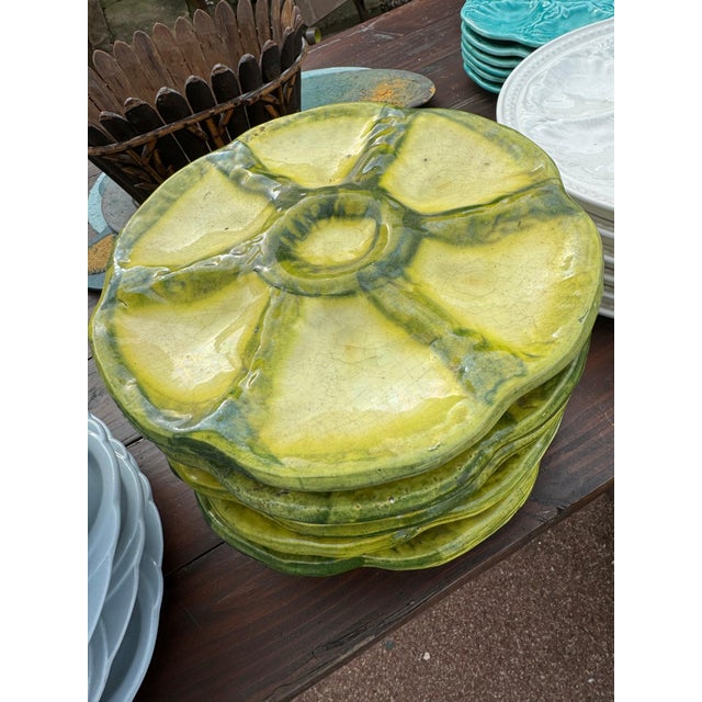 Set of 8 green and yellow French midcentury oyster plates by Foucard Jourdon. 8”dia 44-002