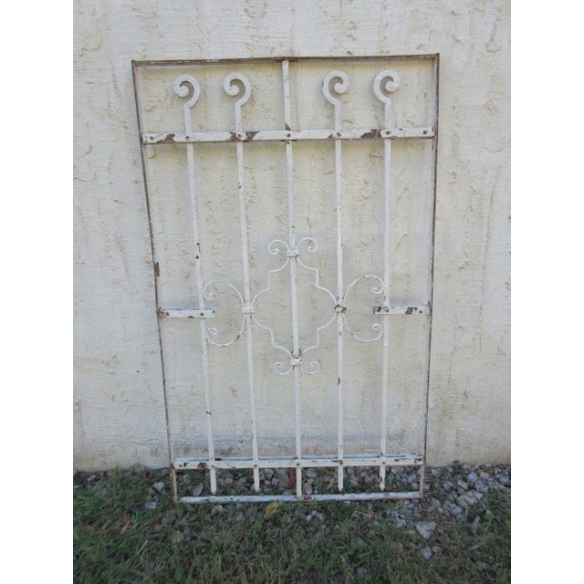 This iron gate/door is a wonderful piece of architecture. Heavy, tight, and sturdy. This piece does show signs of age...