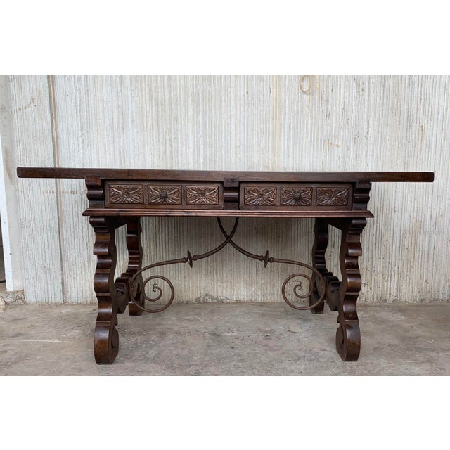 Spectacular 19th century walnut and wrought iron desk with two drawers in each side. Beautiful unique brass metalwork on...
