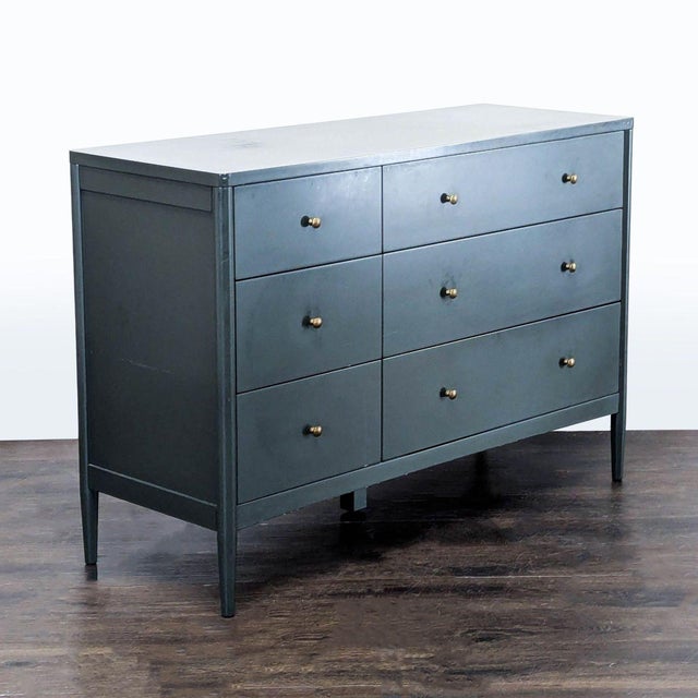 This Crate & Barrel dresser features a sleek finish finish and six spacious drawers with minimalist gold knobs. Its sturdy...