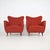 Pair of Italian armchairs produced in the 1950s, distinguished by their soft, enveloping silhouette that reflects the...