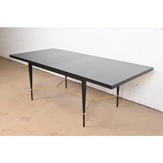 An exceptional Mid-Century Modern extension dining table By Paul McCobb for Directional and produced by Calvin Furniture...