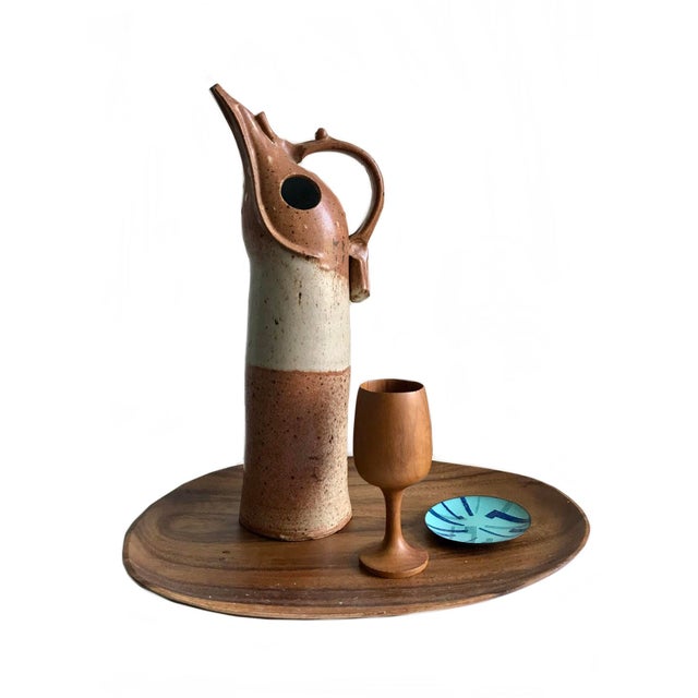 a decorative Novelty Mid Century Modern 1970s studio art pottery stoneware zoomorphic pitcher this hand made tall and...