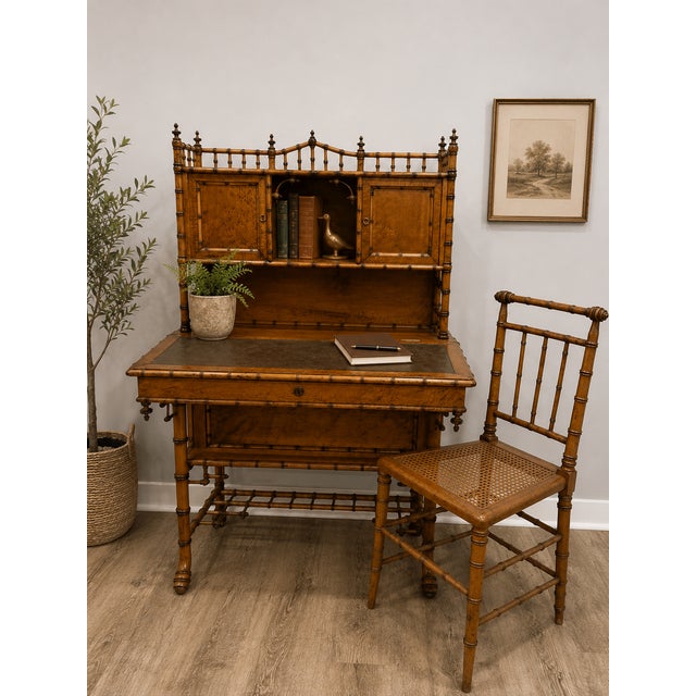 An exceptionally rare late 19th-century American Aesthetic Movement secretary desk with its matching hand-caned chair,...