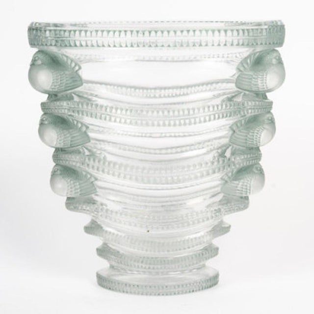 "Saint-Marc" vase in molded, pressed white glass, enhanced with a blue-gray patina. Design created by René Lalique in...