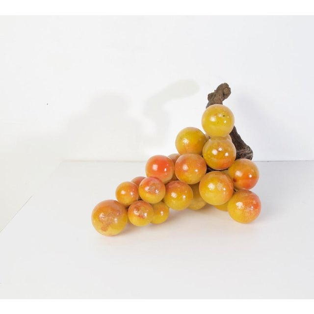 Original midcentury decorative large cluster of grapes in painted alabaster with an olive branch for stem.