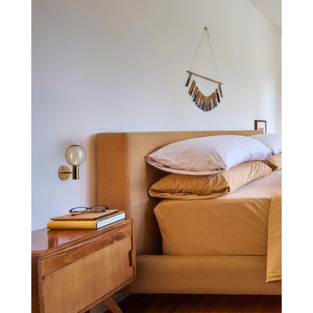 1960s Hans Agne Jakobsson #V149 Glass and Brass Wall Lamp for Markaryd. An incredibly refined vintage design that is...