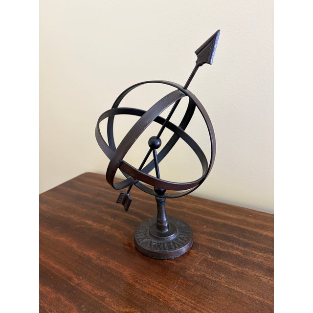 A beautifully crafted iron armillary sphere, evoking the timeless elegance of classical European gardens. Pieces like this...