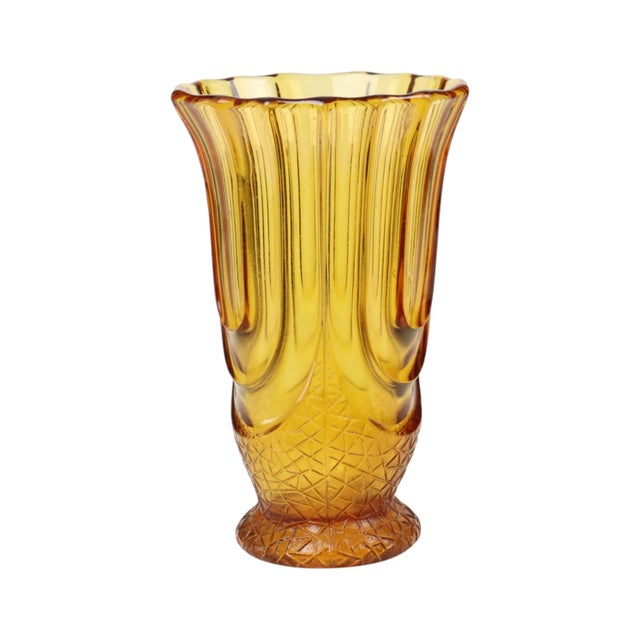 A beautiful and iconic amber-colored Art Deco vase known as the ‘Luxor’ model; designed by Henri Heemskerk and...