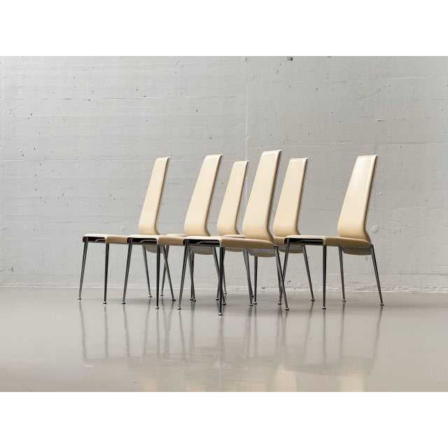 An elegant set of chairs from the italian manufacturer arper, crafted in italy. The chairs are distinguished by their...