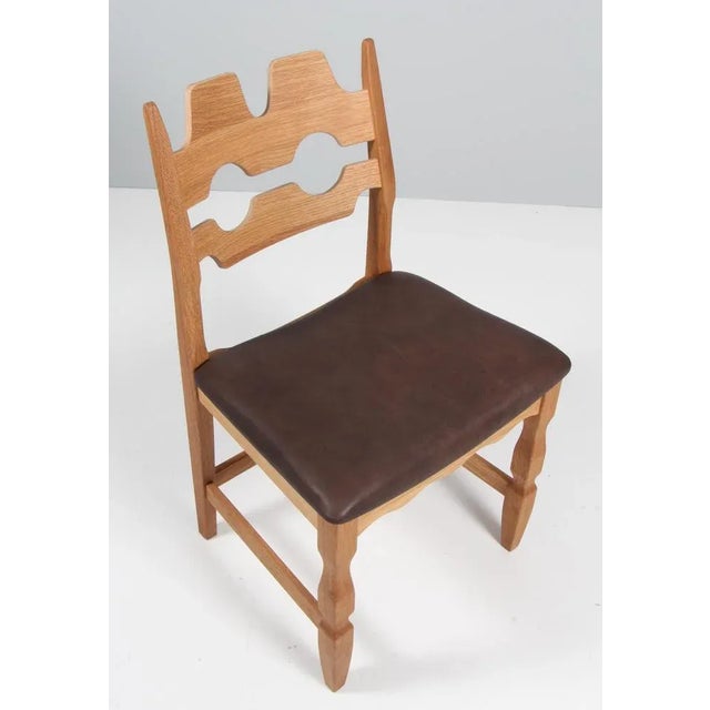 A striking dining chair by Henning Kjærnulf, made of oak and ready for you to upholster Refreshing design with bold...