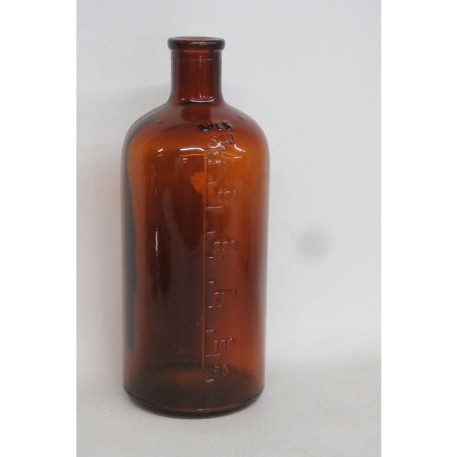This gorgeous Apothecary Medicinal Bottle / Vase is made of glass. This beautiful bottle features a gorgeous amber color...