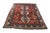 This striking antique "Lori Pambak" tribal rug is a commanding masterpiece of nomadic weaving. Featuring a vibrant madder-...