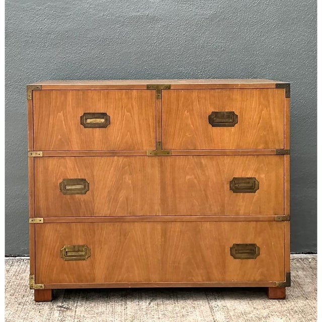 Exemplifying the renowned craftsmanship and timeless utility characteristic of fine Baker furniture, this vintage campaign...