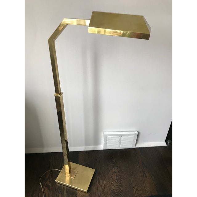 Pharmacy style brass reading floor lamps designed by Chapman in the 1970s. Weighted rectangular base supports adjustable...