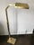 Pharmacy style brass reading floor lamps designed by Chapman in the 1970s. Weighted rectangular base supports adjustable...