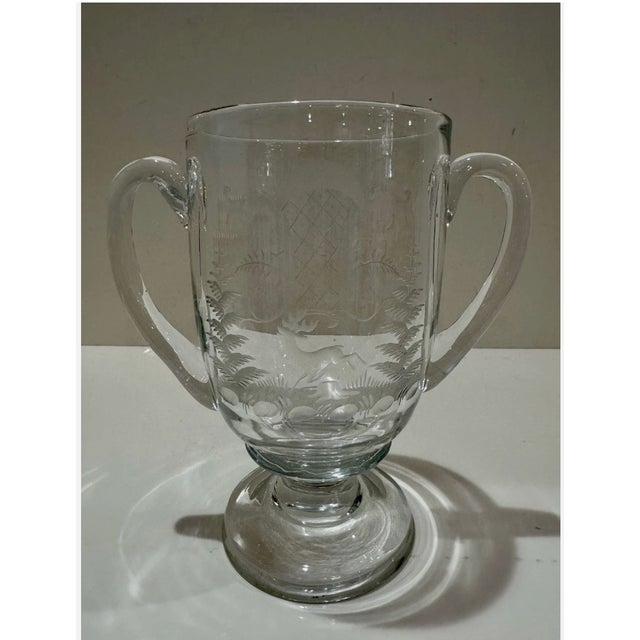 Antique clear glass loving cup or trophy form vase, likely Bohemian or Central European, dating to the late 19th or early...