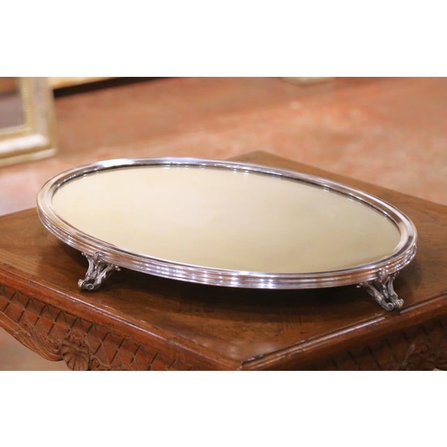 This refined antique French surtout de table, stamped Baccarat on the underside of the mirrored plateau, was crafted circa...