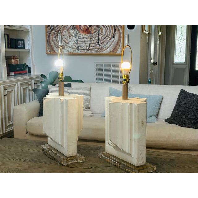 A spectacular and exceptionally sculptural matching pair of Casual Lamps of California table lamps, dated 1990, combining...