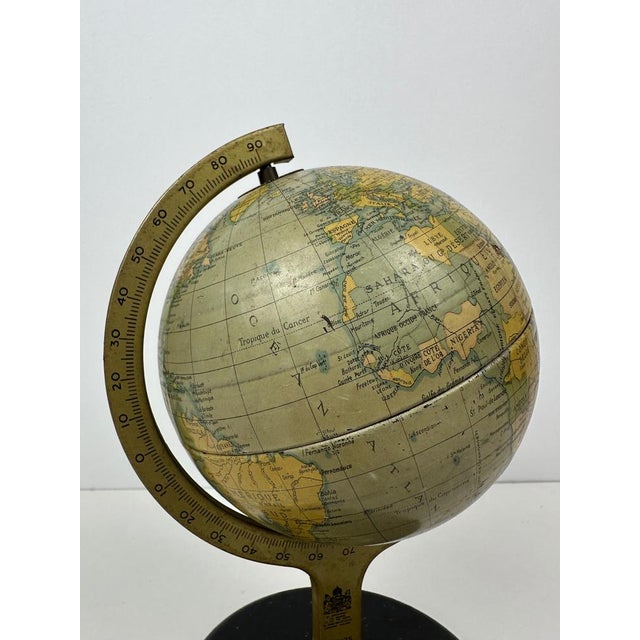 Vintage tin globe. Marked: Chad Valley. Made in England. French version. Numbered: 10175. Features a protractor and time...