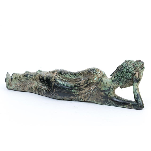 Thai Bronze Reclining Buddha Sculpture With Verdigris Patina Bring a sense of profound serenity and timeless elegance to...