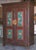 Folk art painted armoire. Interior shelving has been added to accommodate computer etc. We can customize interior for any...